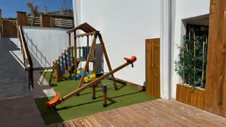 Outdoor children's swing and seesaw area