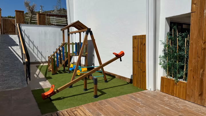 Outdoor children's swing and seesaw area