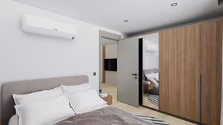 Interior visualisation of a bedroom with built-in storage.