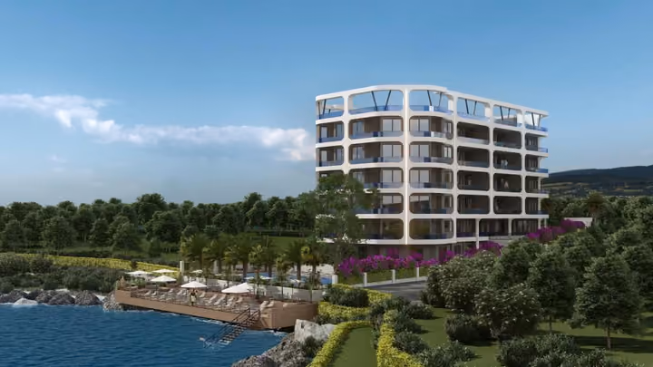 Architectural rendering of the building, waterfront deck and landscaped coastal setting