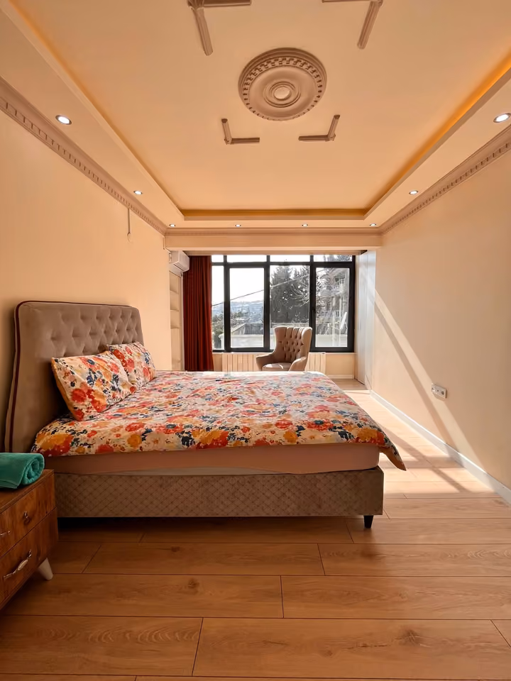 Floral bedroom alternate view in the furnished seafront mansion in Buyukcekmece.
