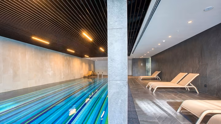 Indoor pool with timber ceiling and lounge area in Boyalik, Cesme.