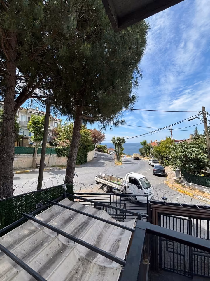 Entrance and surrounding street as seen from the property.