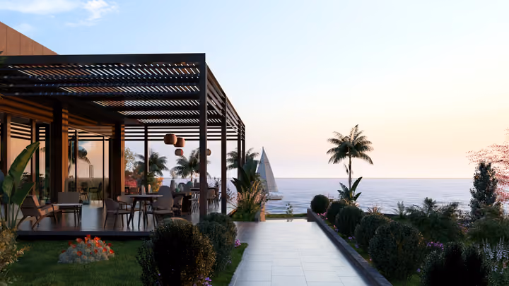 A sheltered pavilion terrace and path with the sea illustrated beyond. Architectural render supplied in the project source folder; it illustrates the proposed design.