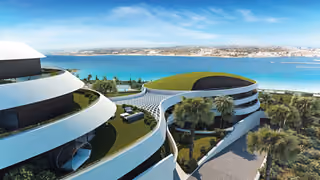 Architectural visualization across the stepped buildings and green roofs toward the bay.