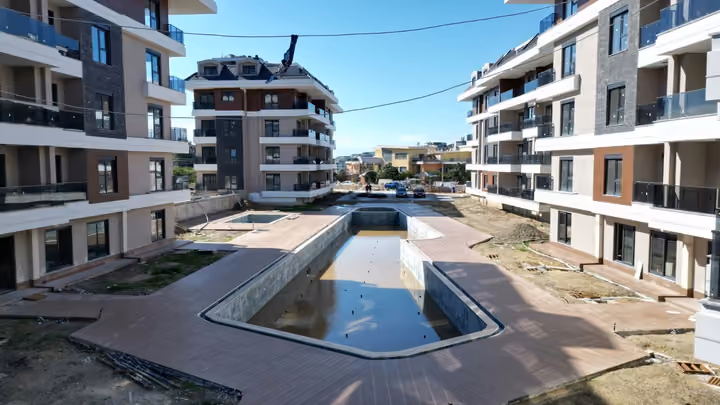 Courtyard photograph showing the pool area under work in Oba Alanya in February 2026