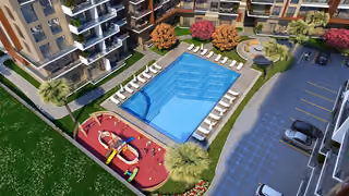Architectural rendering showing the outdoor pool, sun loungers and children’s playground from above.
