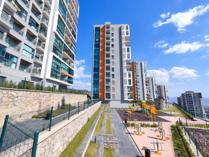 Playground and pedestrian route between buildings.