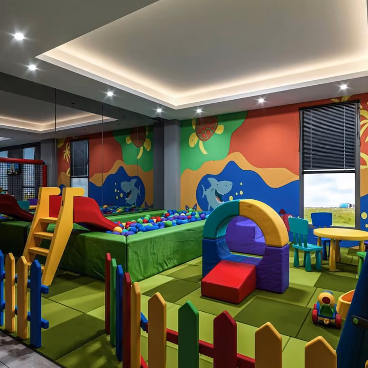 Rendering of the indoor playroom with slides and a ball pit