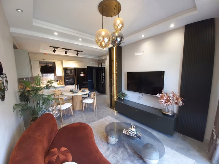 The media wall and seating area in a furnished show apartment.
