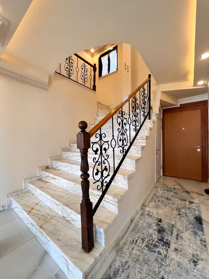 Entrance hall staircase in the furnished seafront mansion in Buyukcekmece.