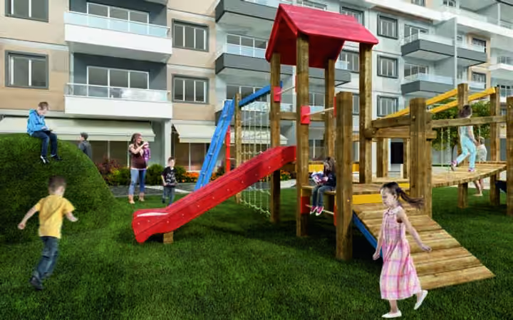 Architectural visualization of slides and climbing equipment on the landscaped grounds.