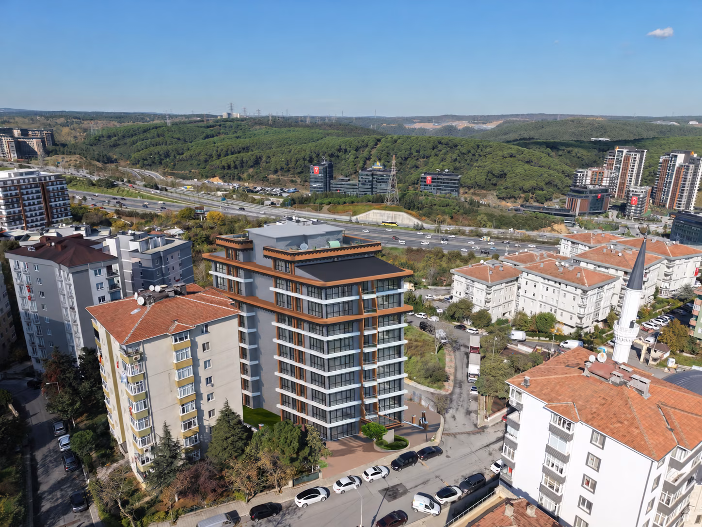Apartments in Hamidiye with surrounding streets and a forest backdrop.