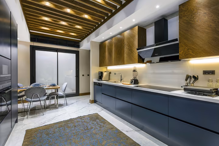Photograph of apartment kitchen and dining area.