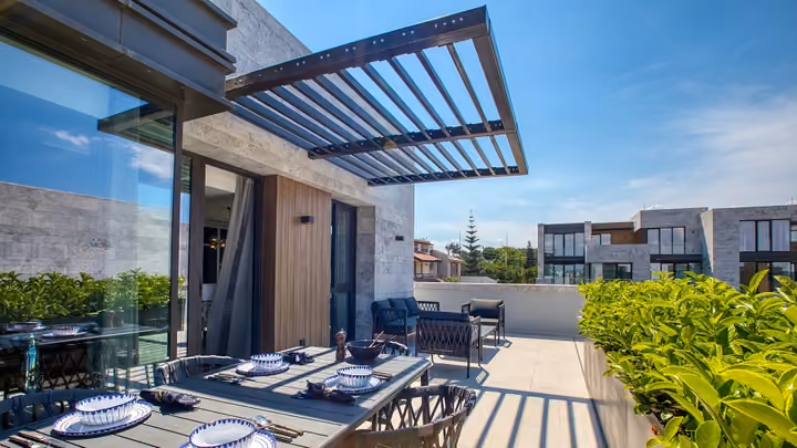 Outdoor dining terrace overlooking the courtyard in Boyalik, Cesme.