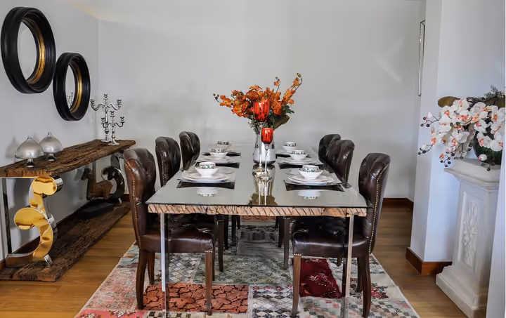 Dining table in a furnished apartment interior.