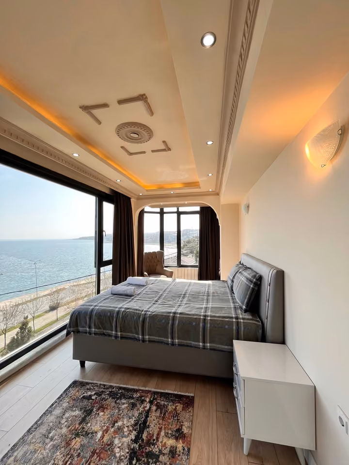 Bedroom coastal panorama in the furnished seafront mansion in Buyukcekmece.
