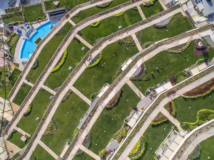 Aerial view of landscaped terraces and the swimming pool.