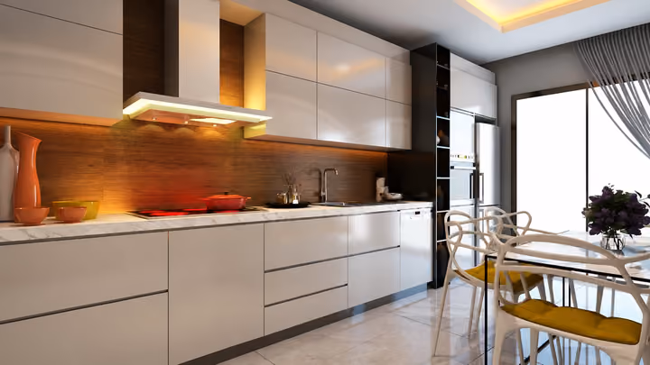 Interior rendering showing fitted kitchen units, a cooking area and a dining table beside a window.
