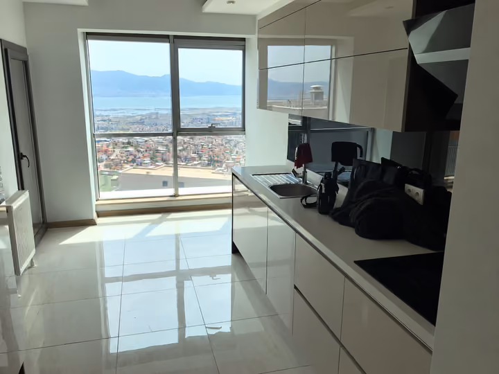 Separate kitchen with appliances and bay views.