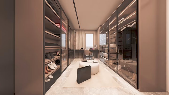 A dressing room lined with glass fronted wardrobes and a vanity at the far end. Architectural render supplied in the project source folder; it illustrates the proposed design.