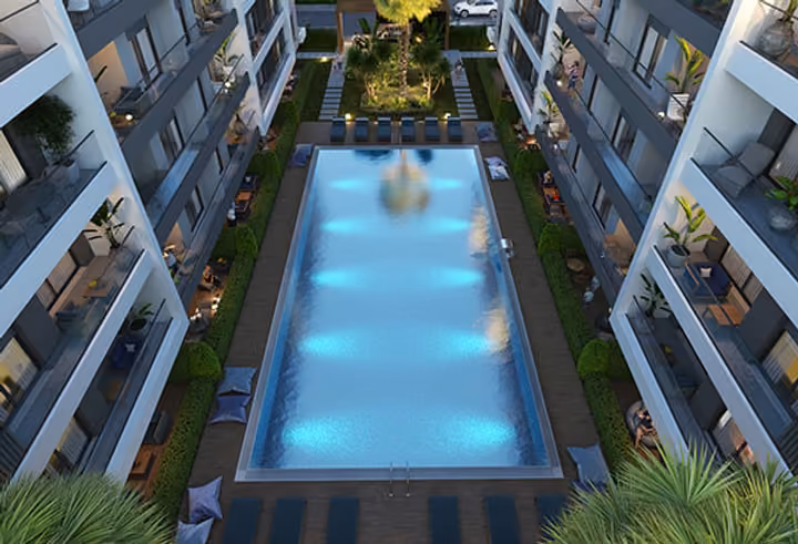 Architectural visualization looking down over the rectangular pool, loungers and courtyard planting.