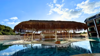 Shaded seating island in the outdoor pool