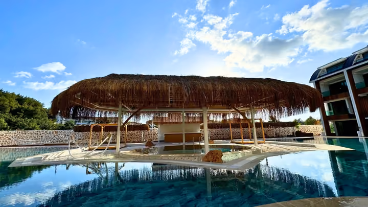 Shaded seating island in the outdoor pool