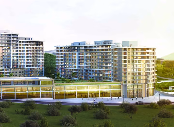 Architectural visualization of the residential blocks and glazed ground-level commercial spaces.