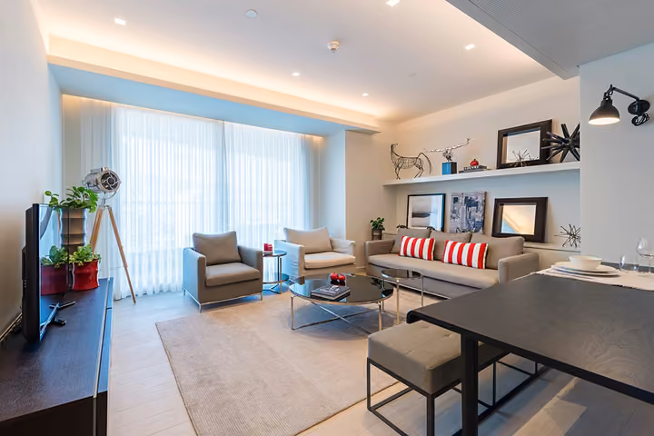 Open kitchen and furnished living area.