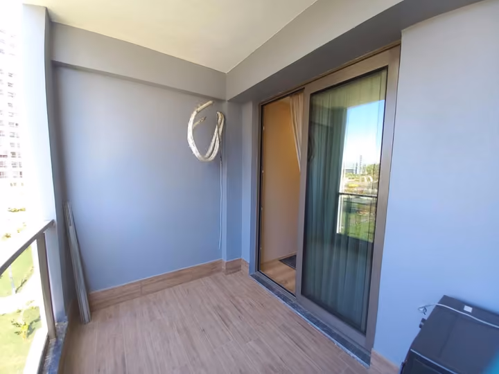 A balcony corner and glazed doorway in a show apartment.