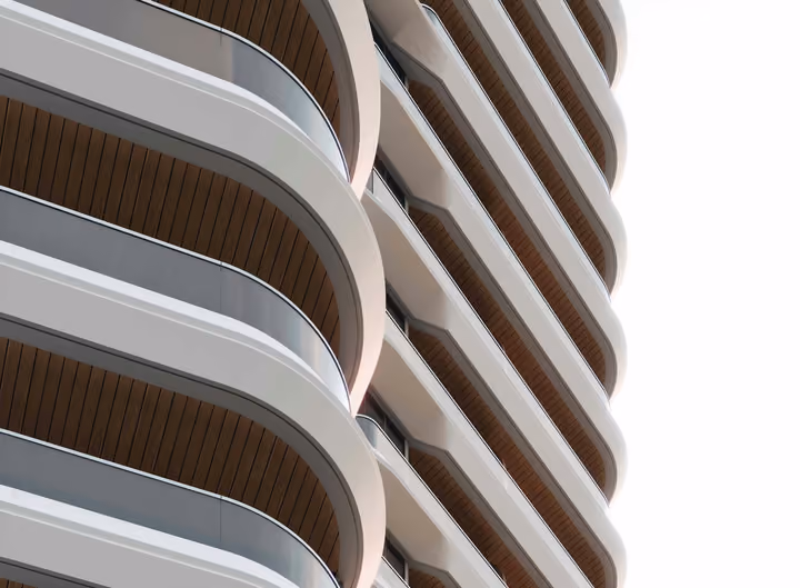 Close architectural visualization of the rounded balconies and glazed facade.