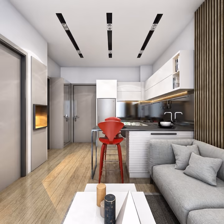 Interior rendering of an open kitchen beside a sofa and dining counter.