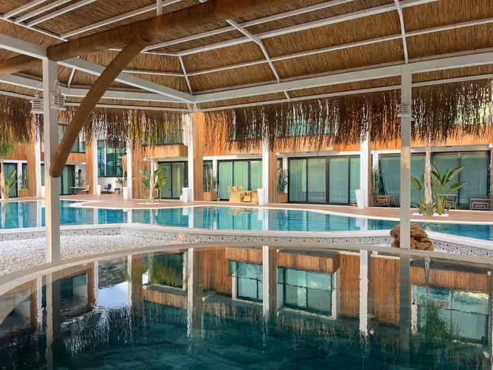 Partially covered pool beside the residential courtyard