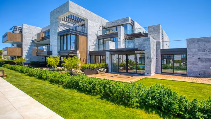 Ground floor terraces beside landscaped lawns in Boyalik, Cesme.