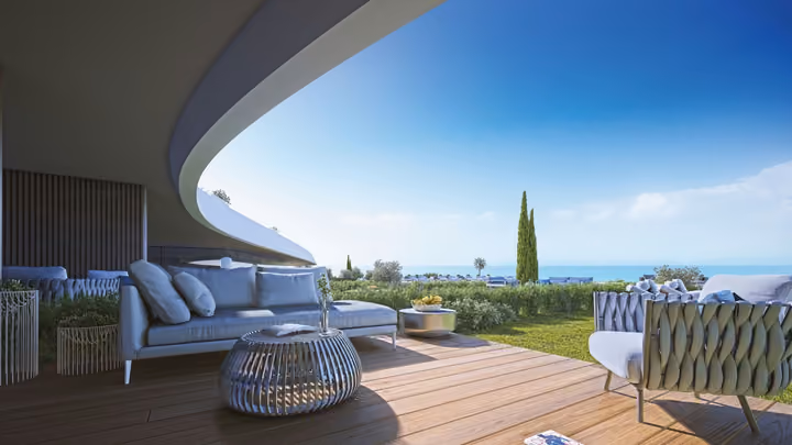 Developer visualization of a sheltered furnished terrace overlooking the sea.