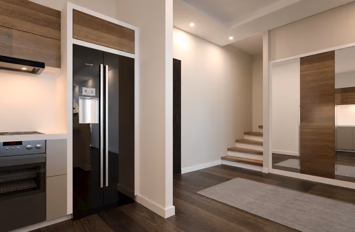 Interior view showing entrance hall connecting the kitchen and stairs in Gaziemir, Izmir.