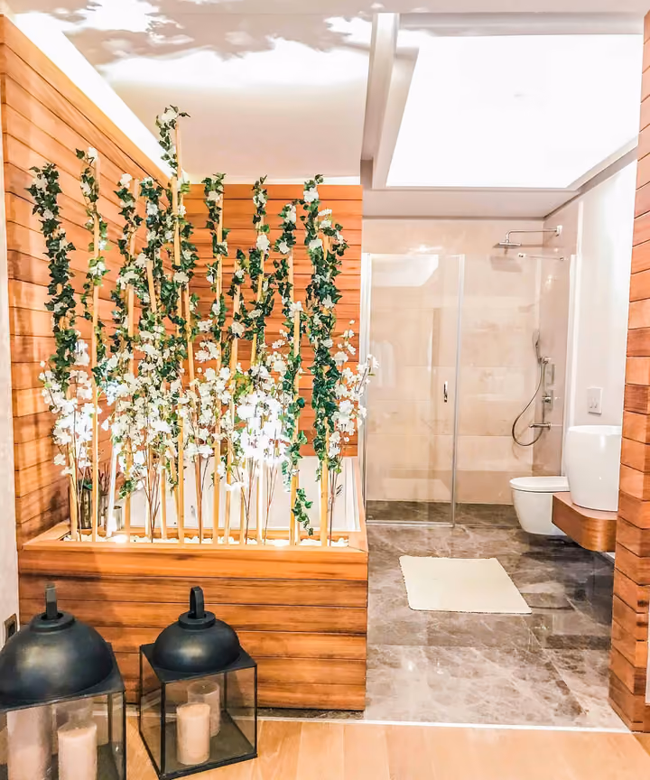 Bathroom with stone surfaces and a shower area.
