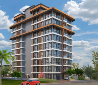 Apartment building with glass balconies and a landscaped entrance.