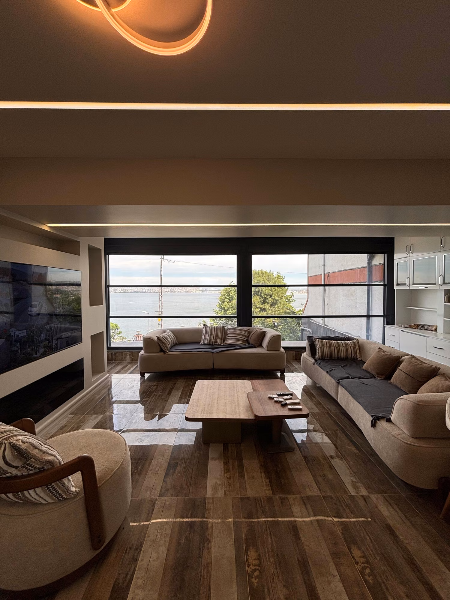 Furnished living room with sea views through large windows in Beylikduzu.