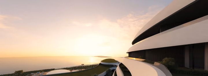 Architectural visualization following the curved balcony edge toward the sea at sunset.
