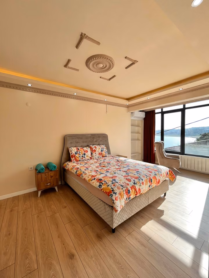 Bedroom floral bedding in the furnished seafront mansion in Buyukcekmece.