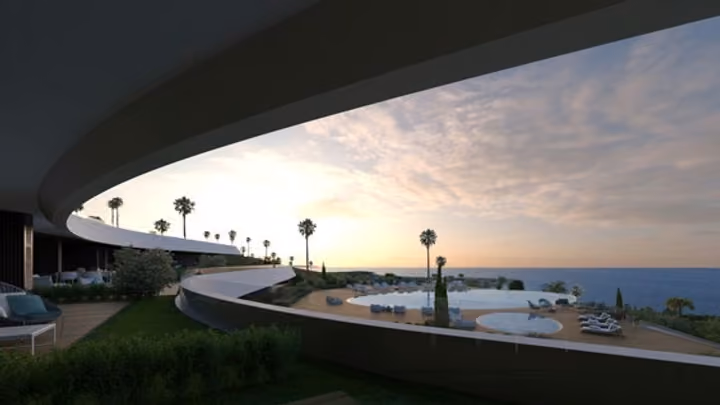 Architectural visualization from beneath a curved balcony toward the pool and sea.