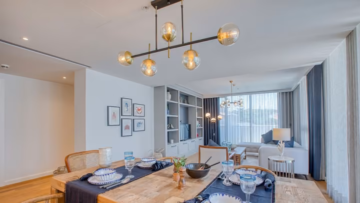 Furnished living and dining area with pendant lighting in Boyalik, Cesme.