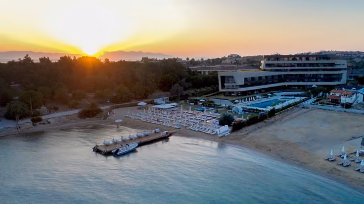 Beach and pool terrace at sunset.