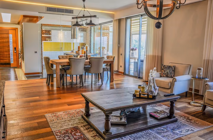 Open living and dining room inside a duplex home.