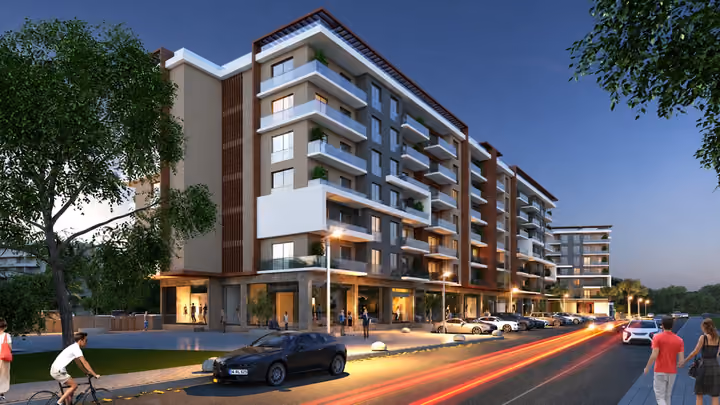 Architectural rendering showing apartment balconies and the street frontage at dusk.