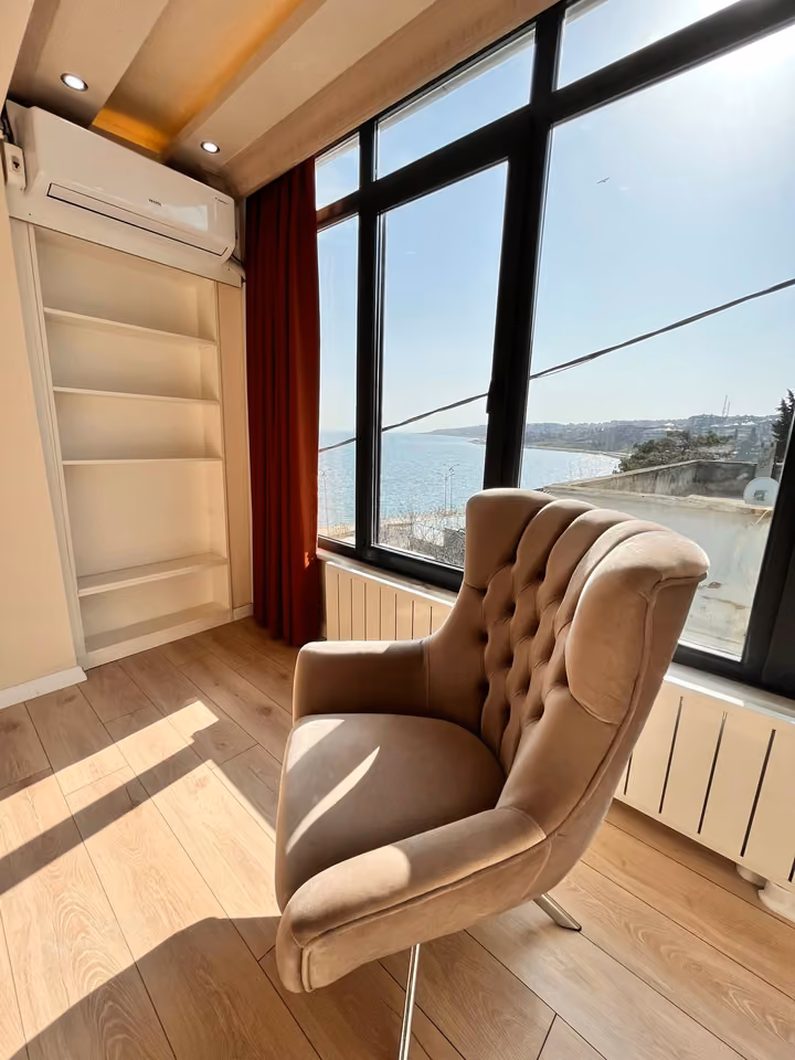 Window reading corner in the furnished seafront mansion in Buyukcekmece.