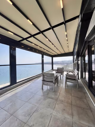 Enclosed terrace coastal view in the furnished seafront mansion in Buyukcekmece.