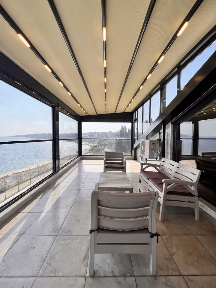 Enclosed terrace seating in the furnished seafront mansion in Buyukcekmece.
